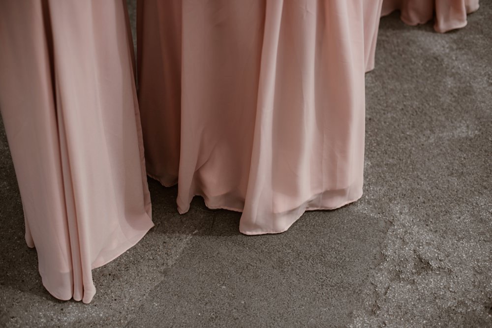 detail of pink bridesmaids dresses