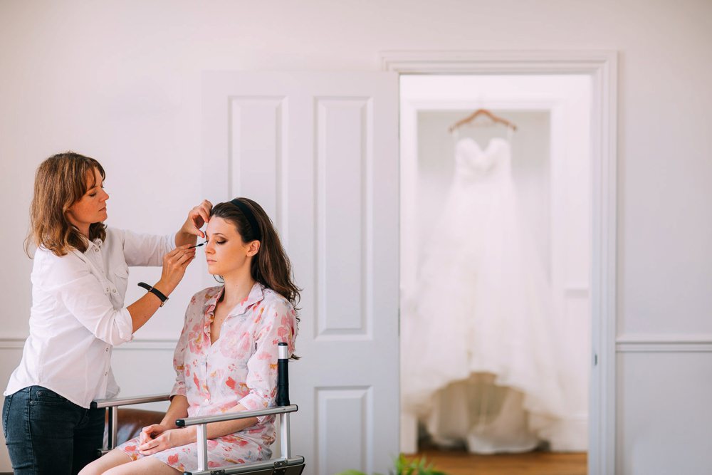 Bride getting ready with make up being applied