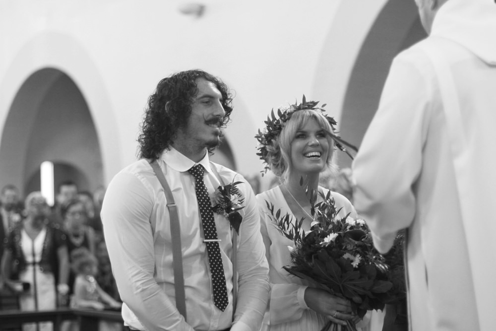 groom and bride laughing during ceremony