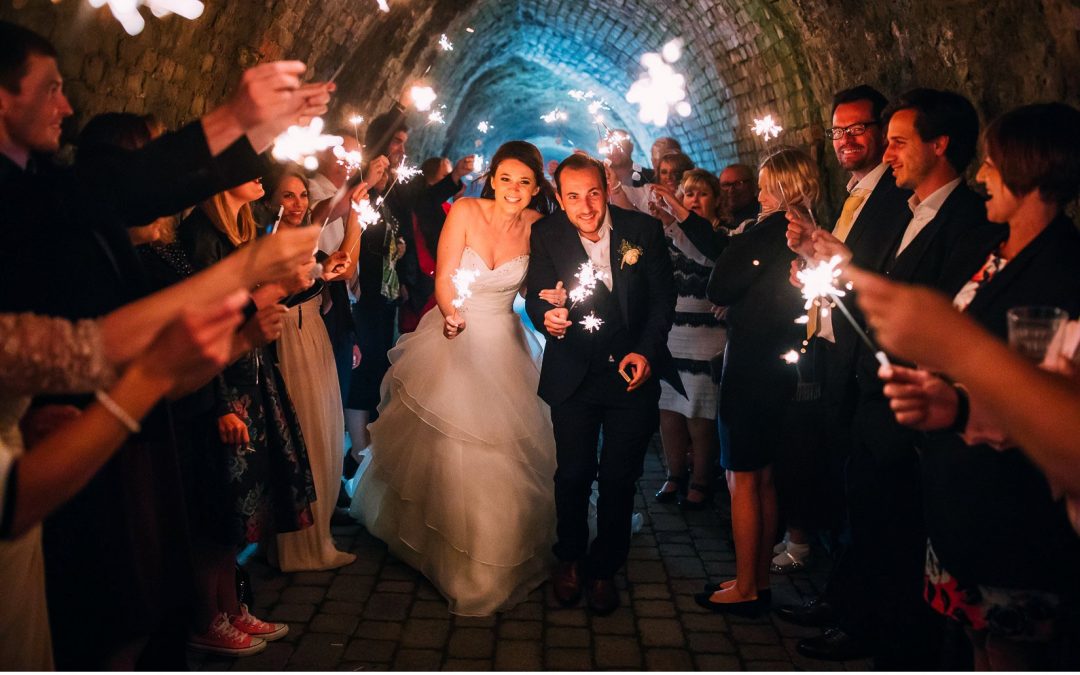 Sparklers and Sophia Tolli Tulle for Travel Inspired Tunnels Beach Wedding